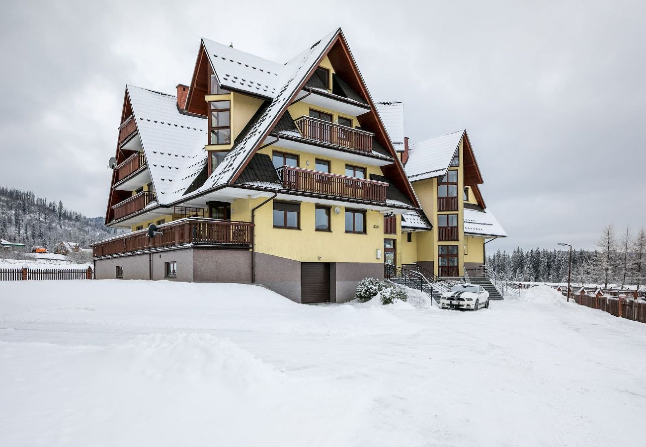 Ferienwohnung in Kościelisko - Gemütliche Familienwohnung mit Balkon und Parkplatz