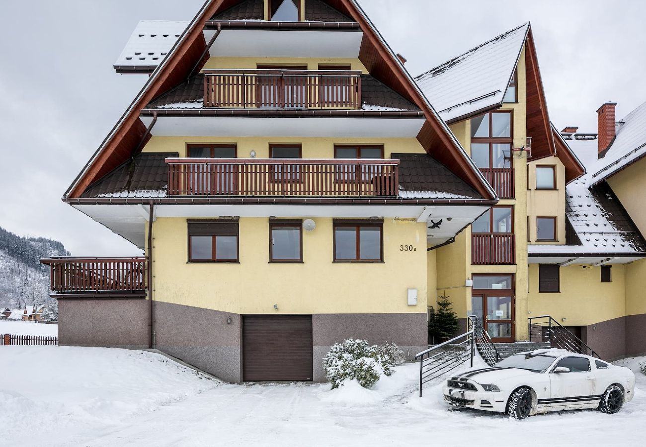 Ferienwohnung in Kościelisko - Gemütliche Familienwohnung mit Balkon und Parkplatz