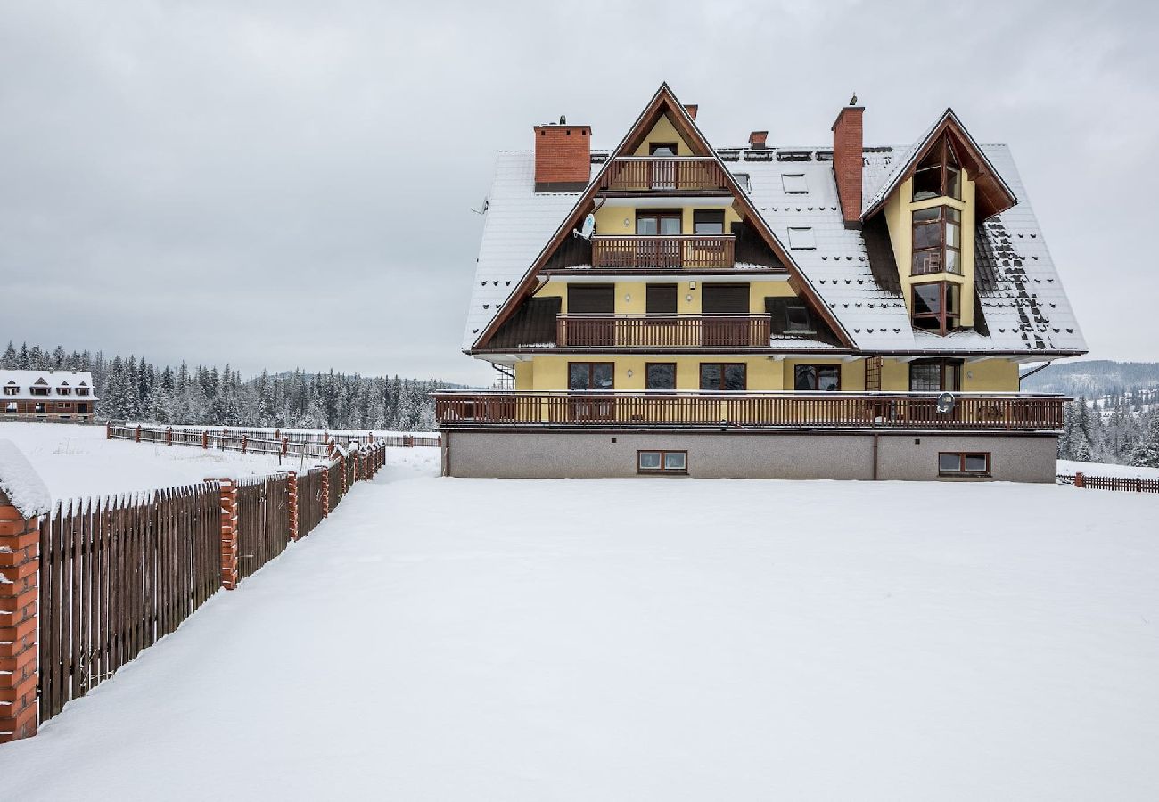 Ferienwohnung in Kościelisko - Gemütliche Familienwohnung mit Balkon und Parkplatz