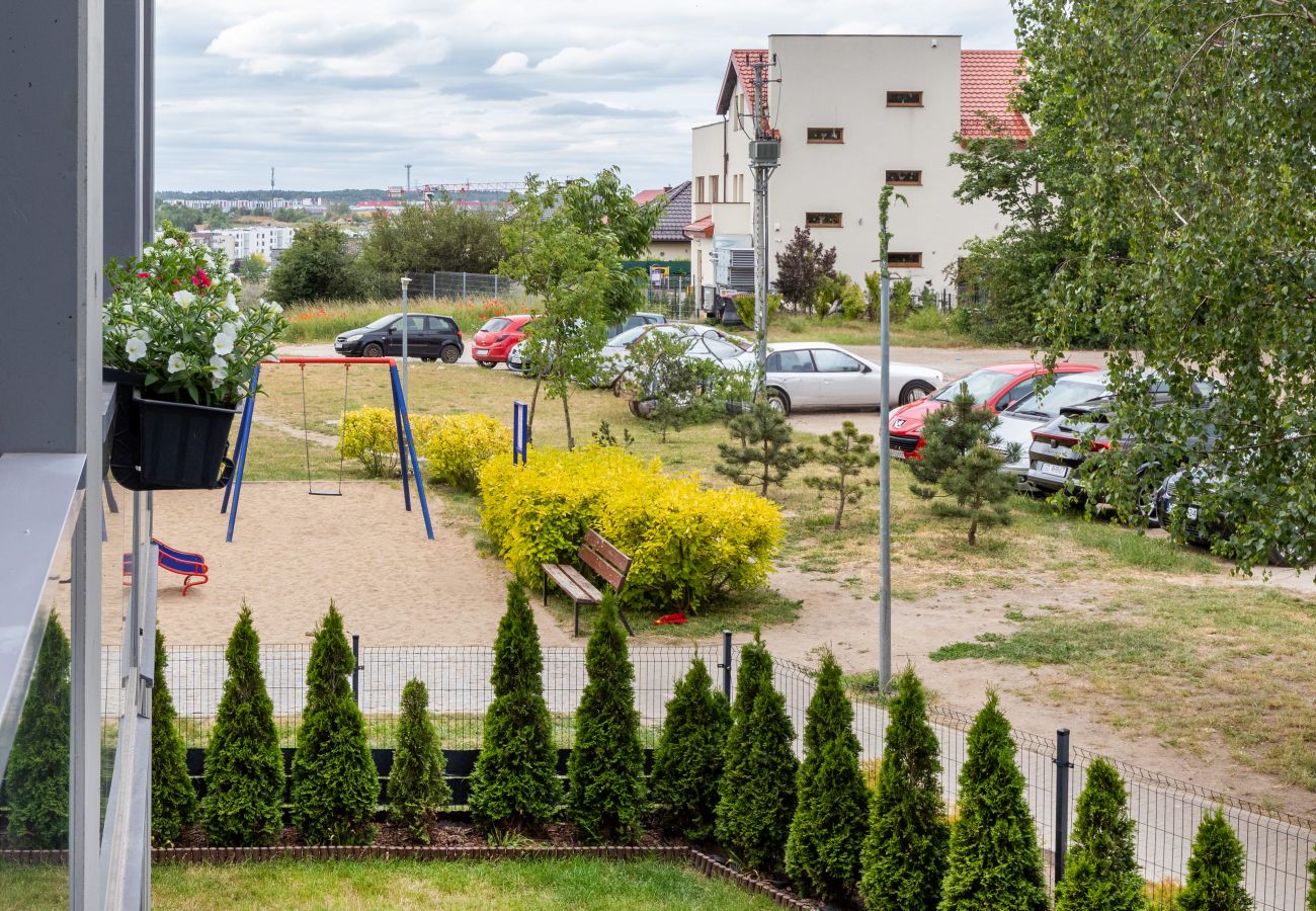 Ferienwohnung in Gdańsk - Modernes Pastell-Apartment mit 1 Schlafzimmer & Parkplatz