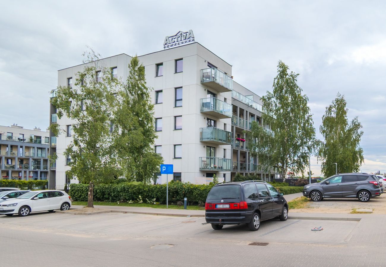 Ferienwohnung in Gdańsk - Modernes Pastell-Apartment mit 1 Schlafzimmer & Parkplatz