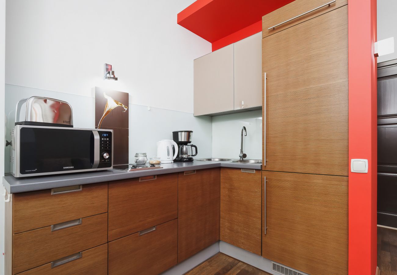 kitchen, kitchenette, fridge freezer, kettle, stove, microwave, coffee machine, toaster, cupboards, dining area, dining table, chairs, apartment, rent