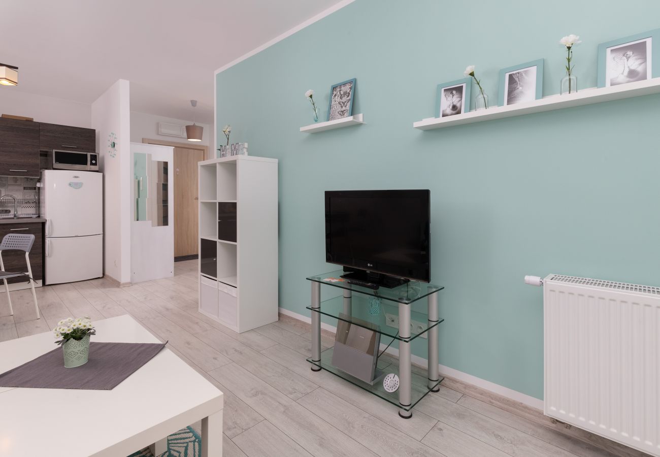 Apartament w Gdańsk - Nowoczesny Pastelowy Apartament z 1 Sypialnią i Miejscem Parkingowym